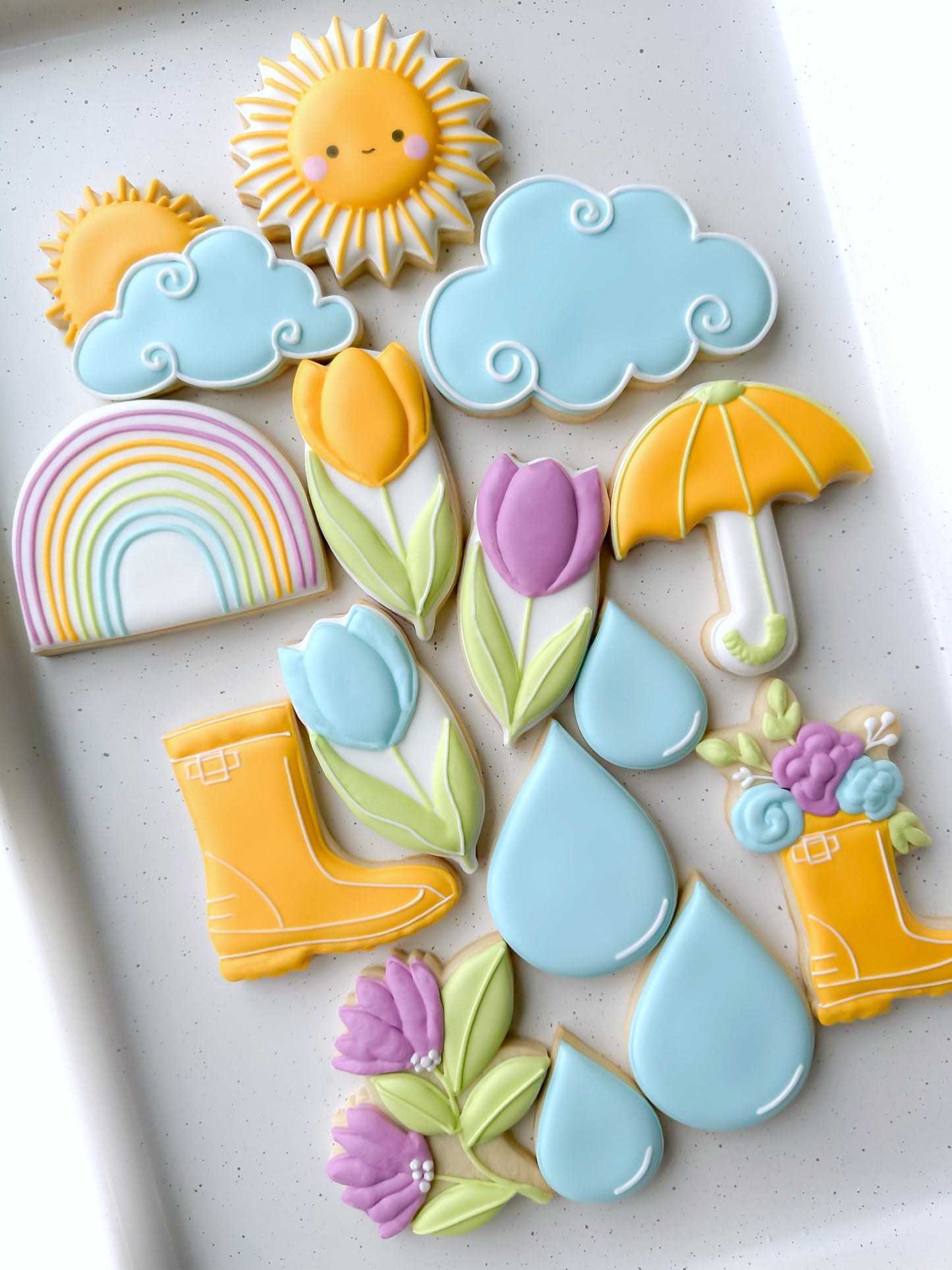 rainy day rainboots, raincoat, raindrop, umbrella, sun behind cloud, rainbow, after the rain comes sunshine, get well, feel better, sympathy cookies, april showers brings may flowers spring garden tulips rainbow sun custom decorated cookies