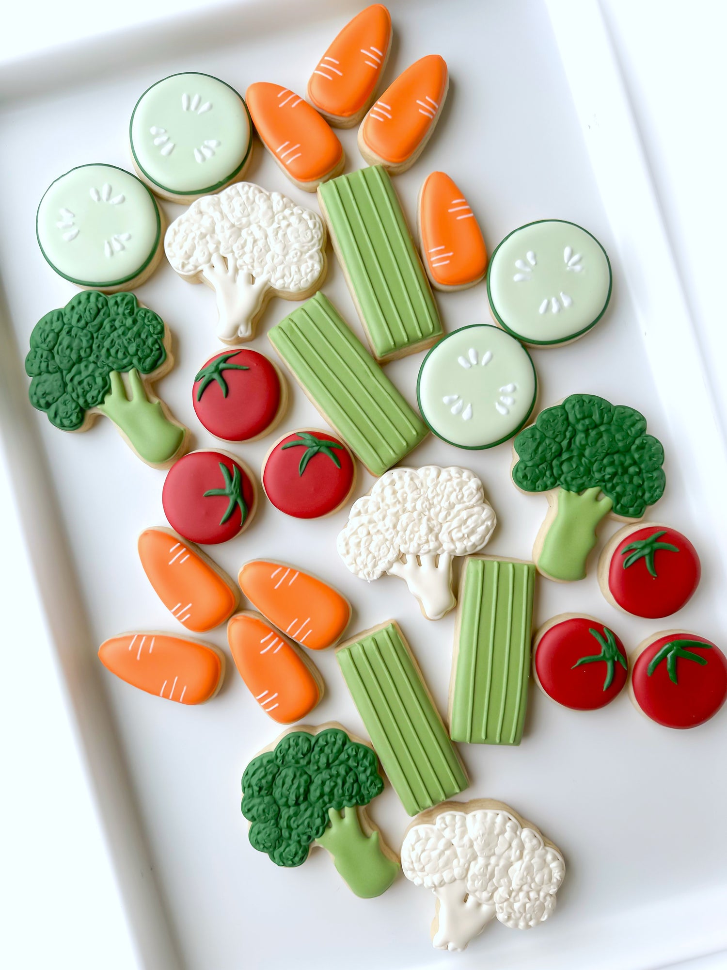 eat your veggies, cauliflower, broccoli, celery sticks, baby carrots, cherry tomatoes, cucumber slice