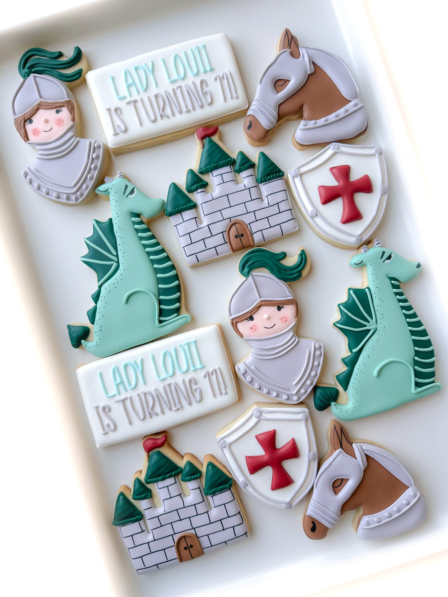 sir knight birthday cookies, dame knight birthday cookies, dragon, castle, medieval, knight shield horse with armor cookies, little slayer birthday cookies, knight in shining armor cookies