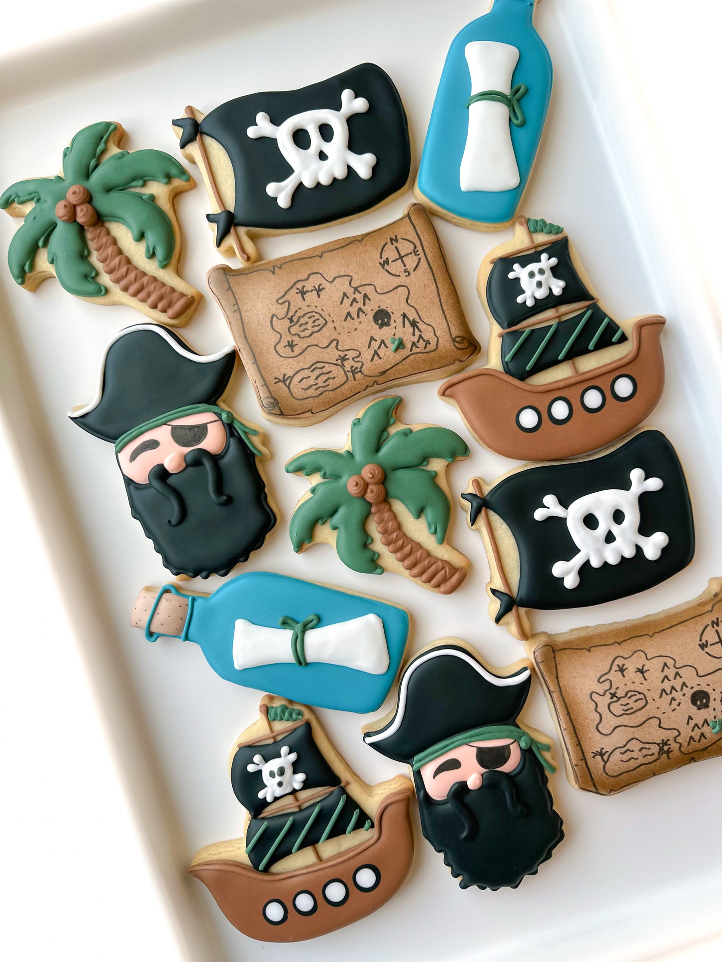 pirate ship palm tree message in a bottle birthday cookies