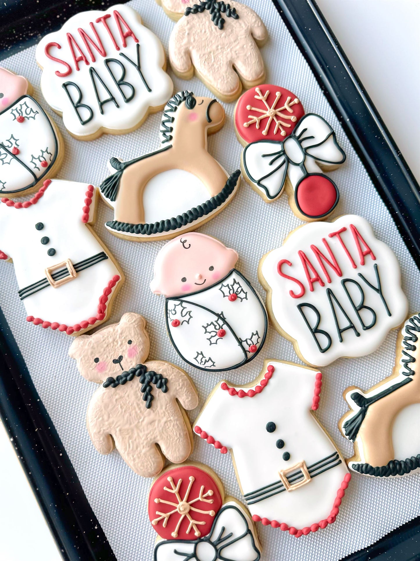 santa baby, rattle, teddy bear, onesie, rocking horse, swaddled baby