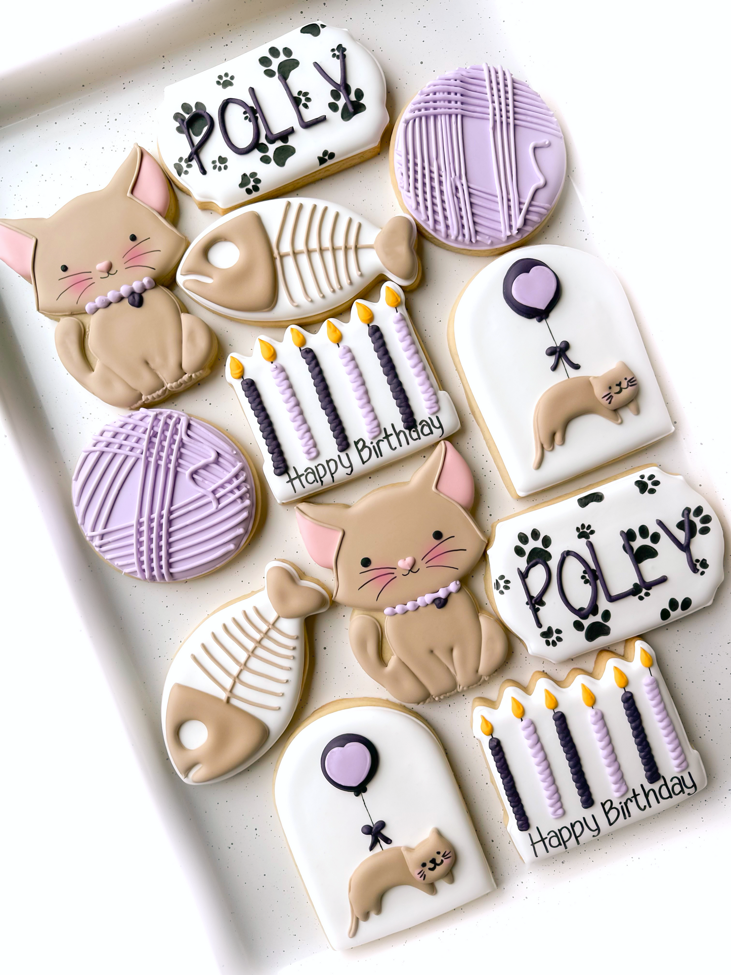 cat, fish bones, ball of yarn, birthday candles, cat with balloon, name plate, age plate