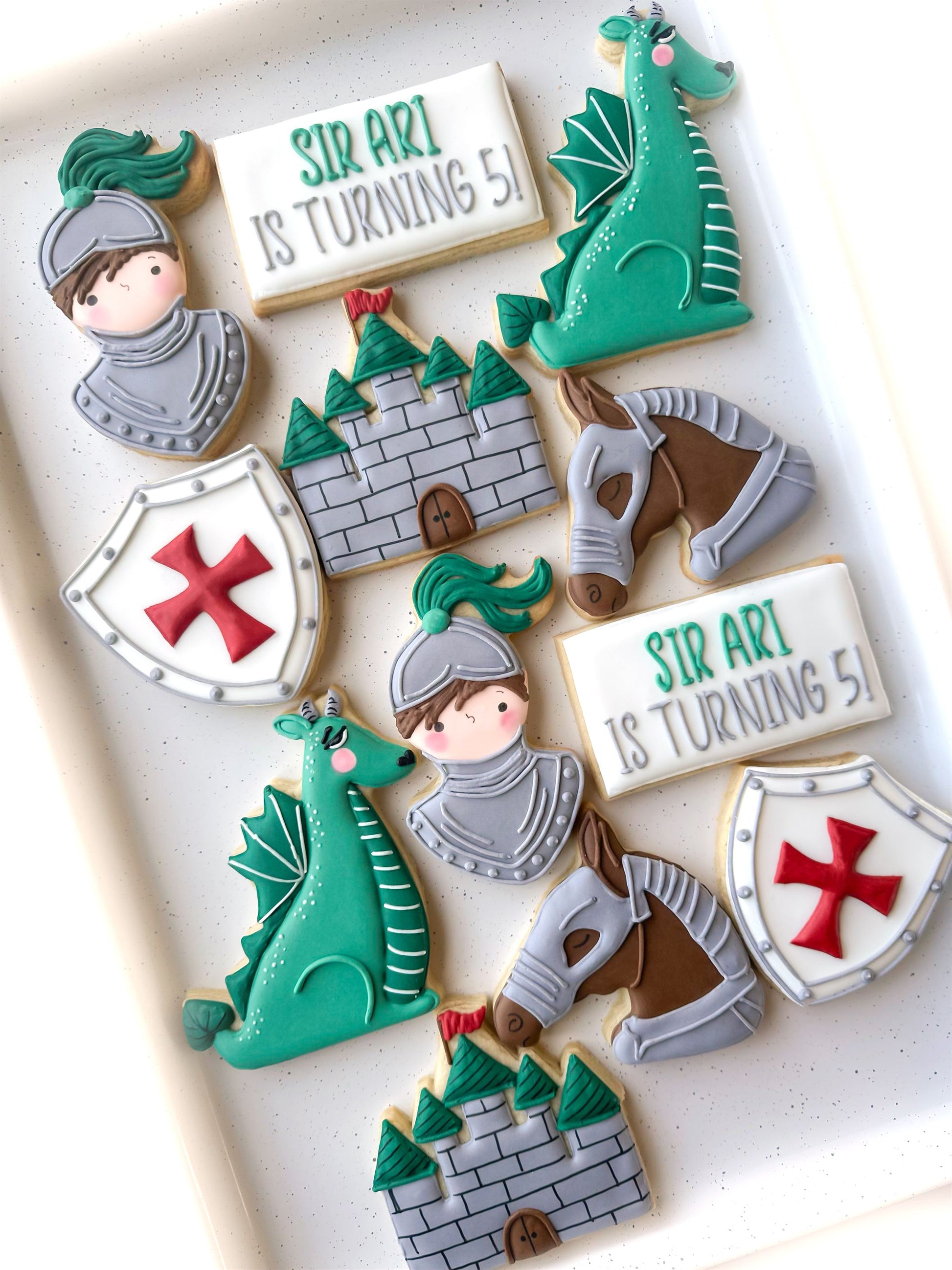 sir knight birthday cookies, dame knight birthday cookies, dragon, castle, medieval, knight shield horse with armor cookies, little slayer birthday cookies, knight in shining armor cookies