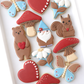 hearts, butterfly, gnome, mushrooms, toadstools, daisies, bear with heart, squirrel with nut, gnome, valentine cookies