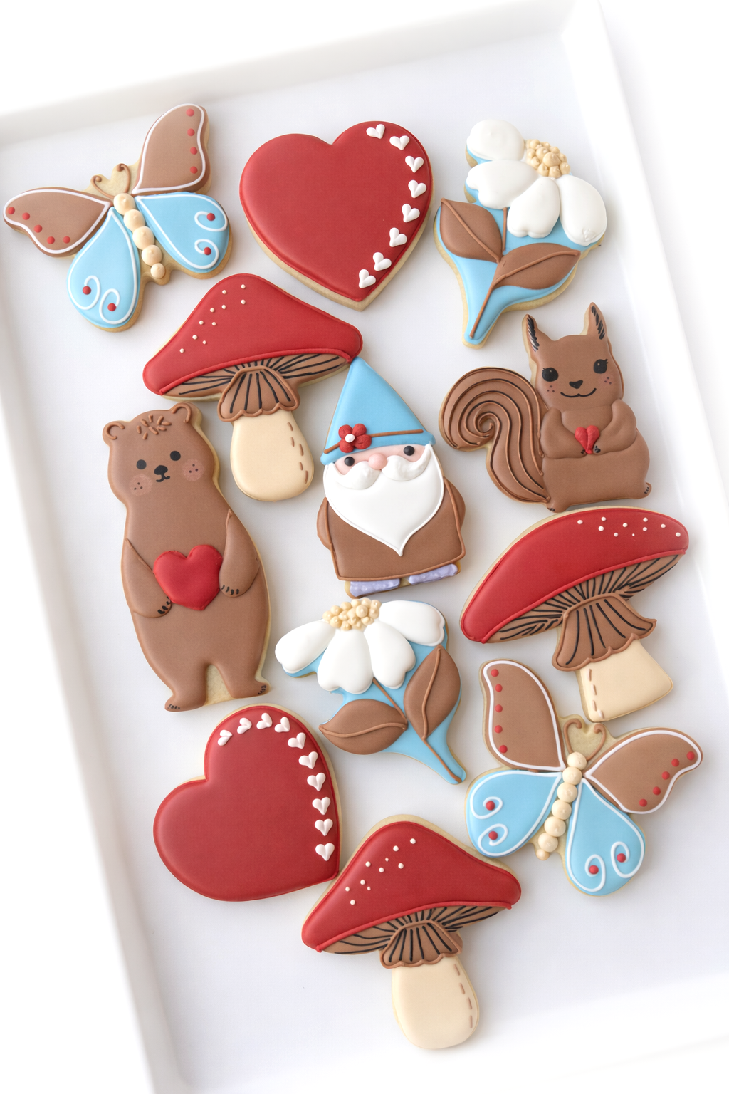 hearts, butterfly, gnome, mushrooms, toadstools, daisies, bear with heart, squirrel with nut, gnome, valentine cookies