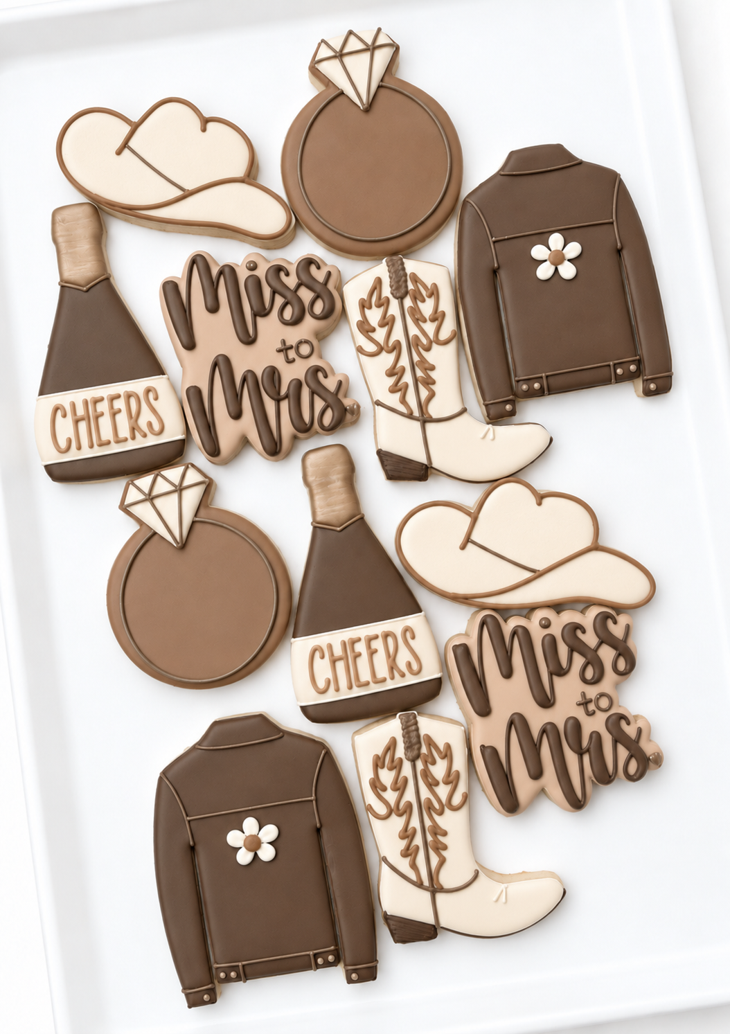miss to mrs western cowgirl engagement bridal shower decorated cookie champagne bottle diamond engagement ring, cowboy boot cowboy hat denim jacket