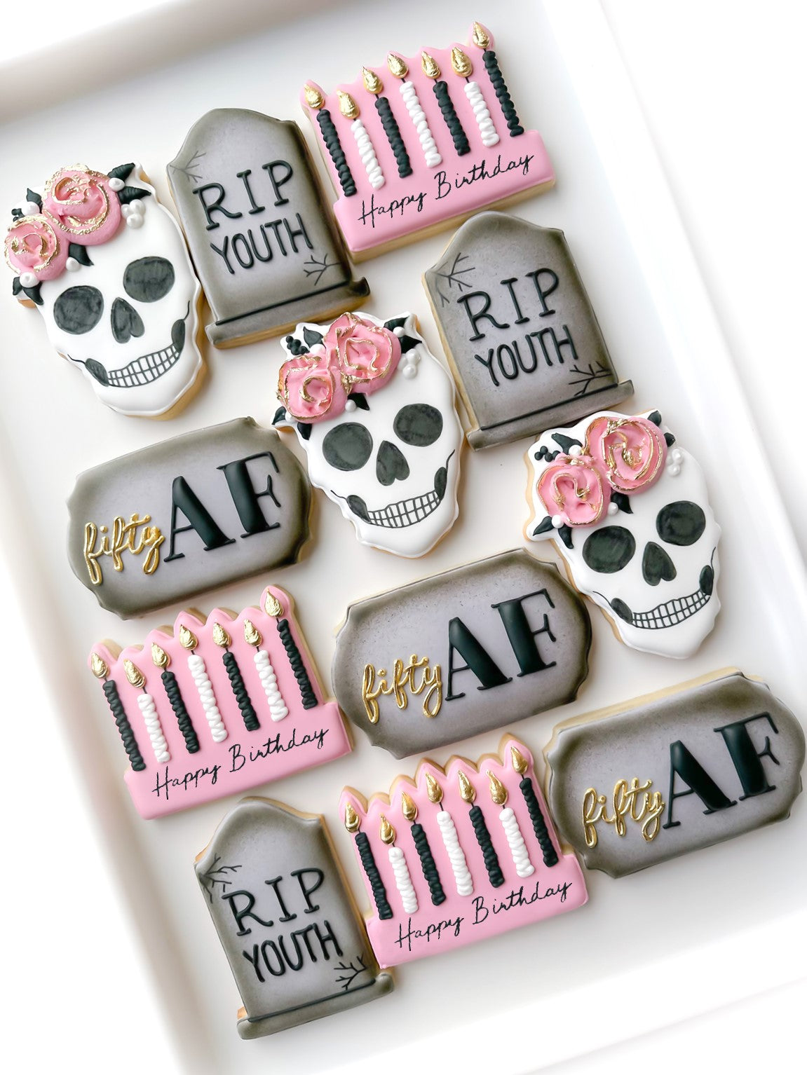 sugar skull with flowers, rip tombstone, casket with flowers, happy birthday candles, over the hill birthday cookies, 40th birthday cookies