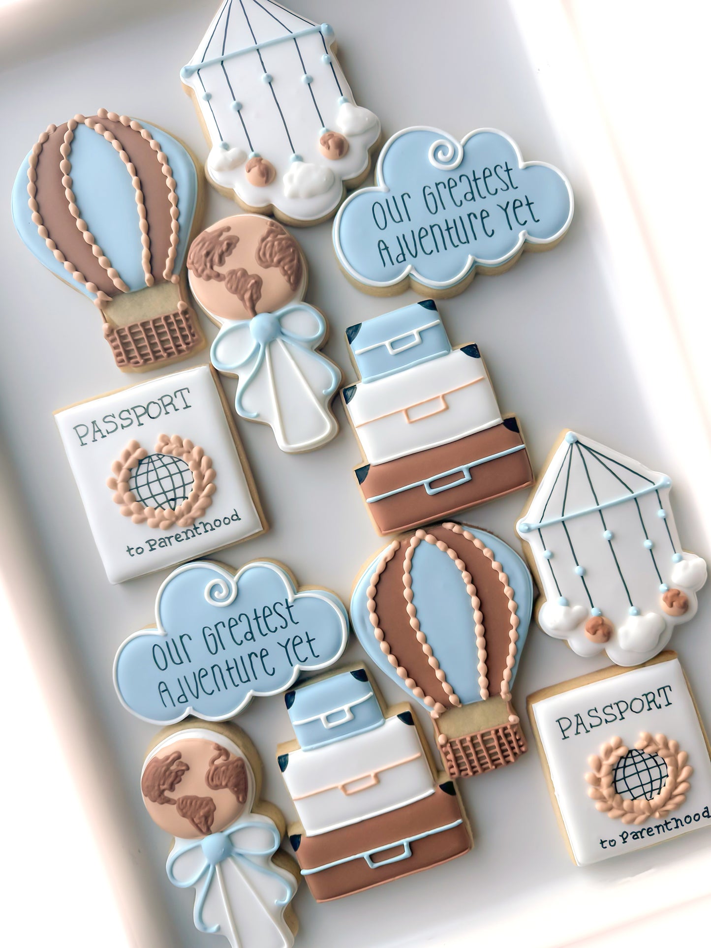 greatest adventure yet baby shower cookies Hot air balloon, cloud, adventure awaits, luggage, compass, passport, air mail envelope, bon voyage with plane, and earth