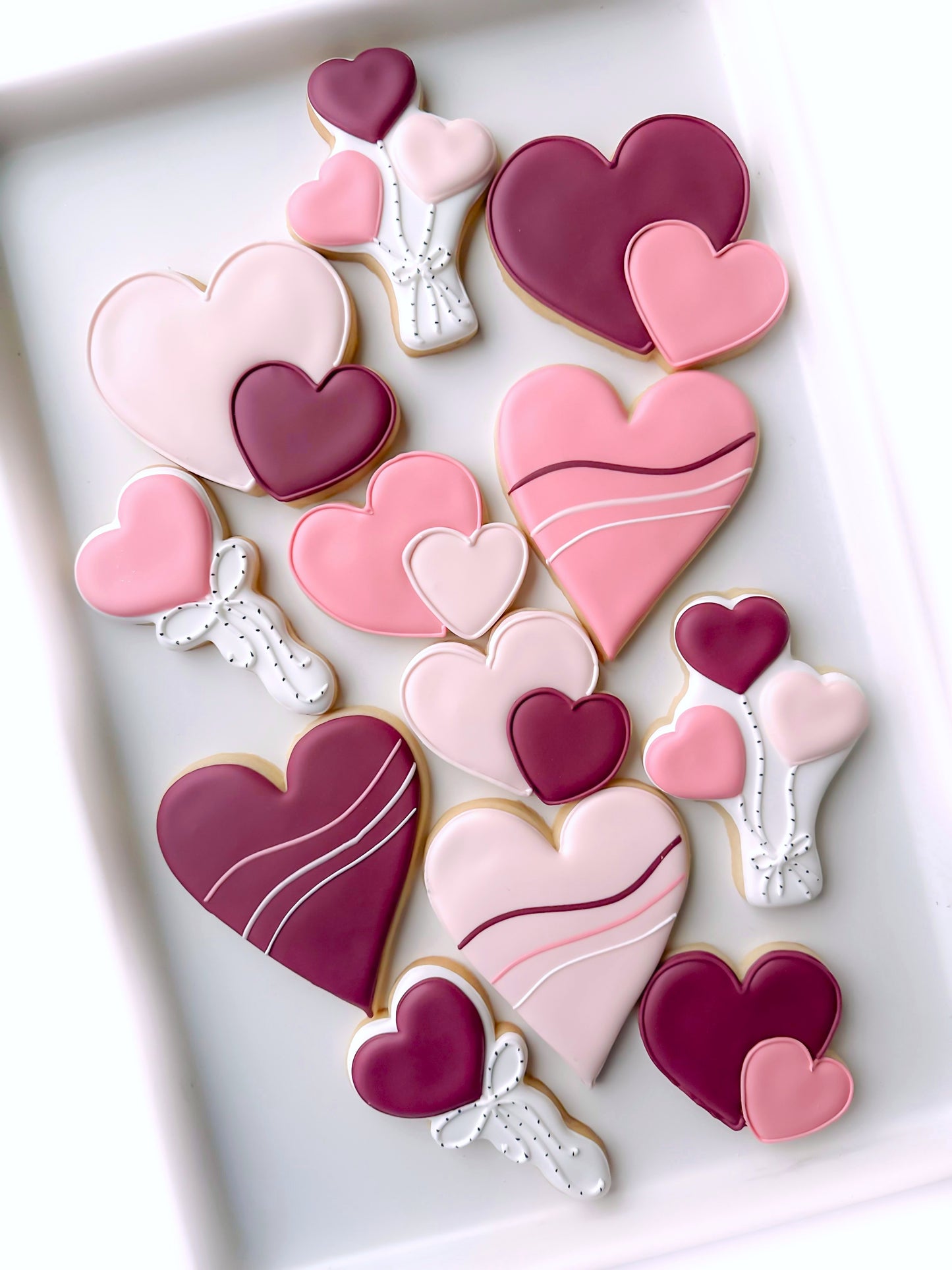 valentines day hearts flowers and balloons decorated cookies